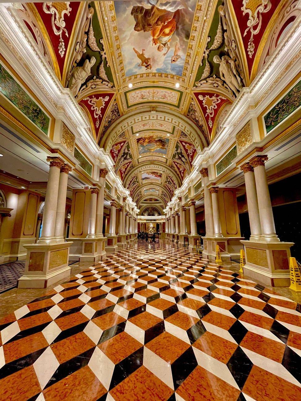Capture the grandeur of the Venetian Hotel's lavish interior with ornate ceilings and checkered floors.