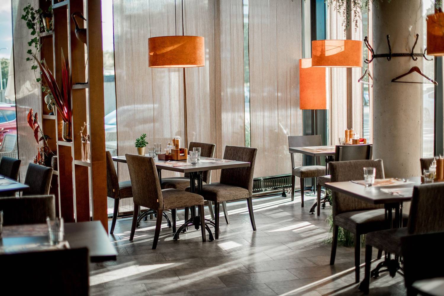 Cozy restaurant interior featuring elegant decor and warm lighting.