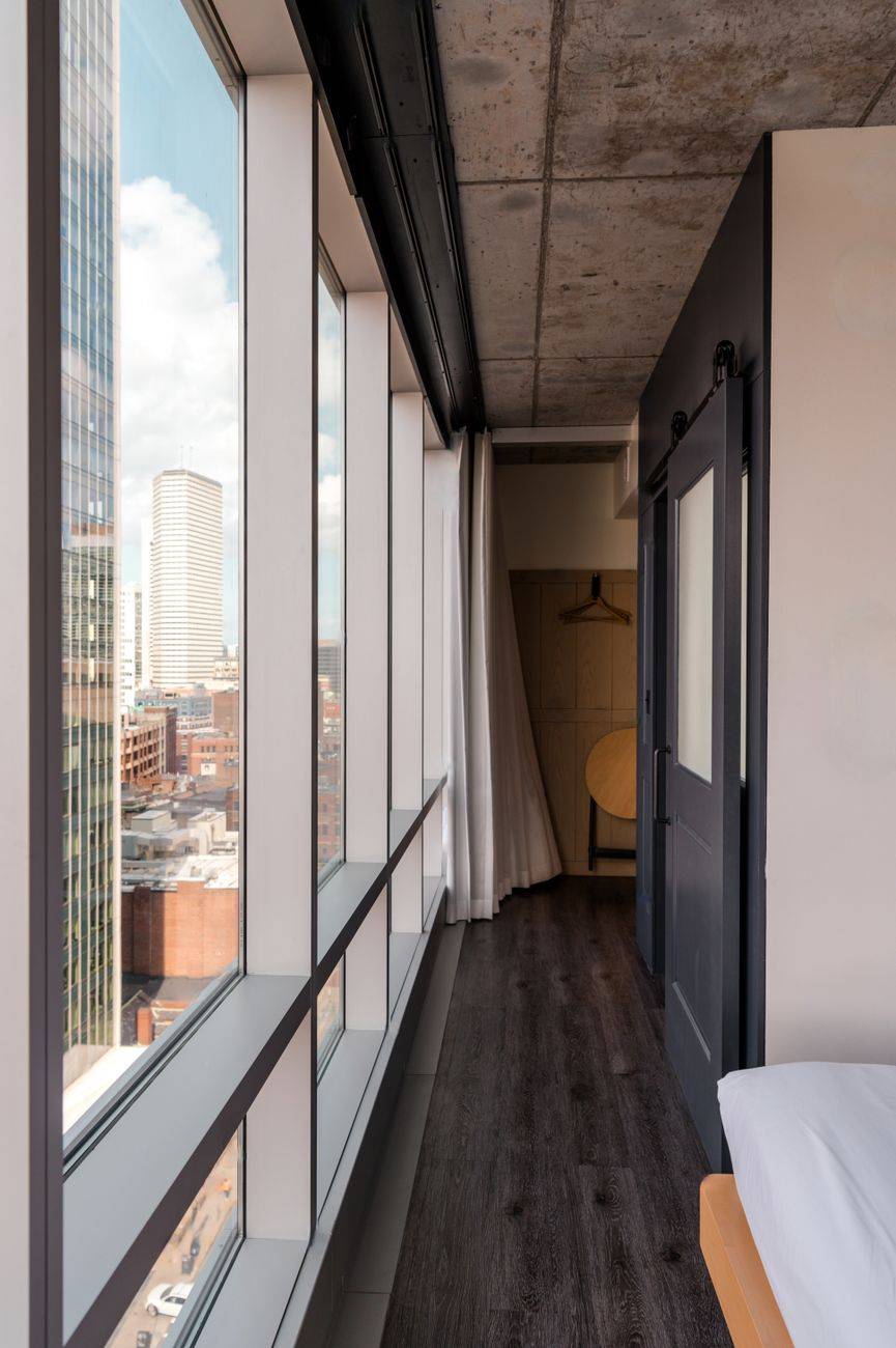Urban hotel room with panoramic views of the Boston skyline.