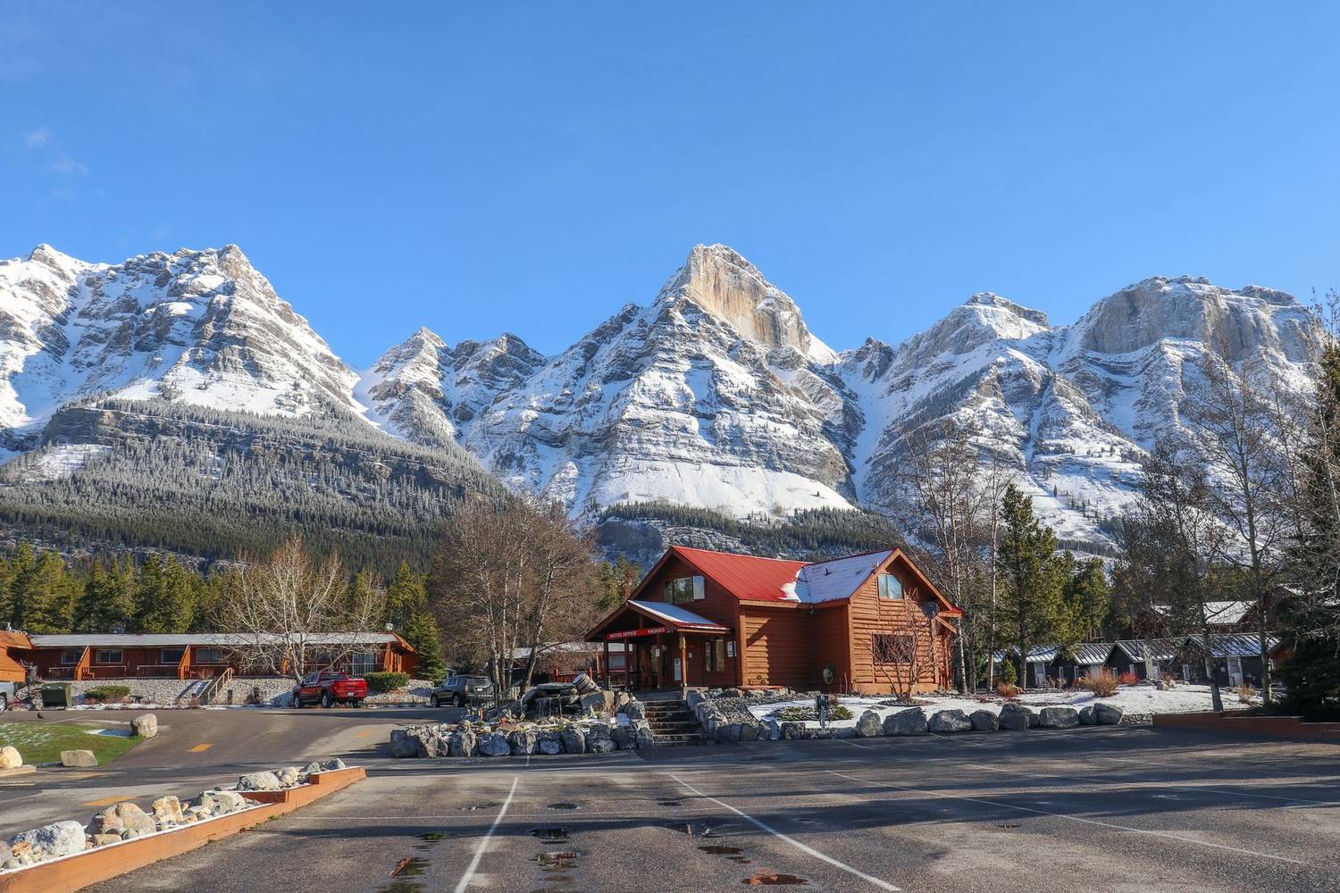 A picturesque lodge set against the stunning Rocky Mountains in Alberta.