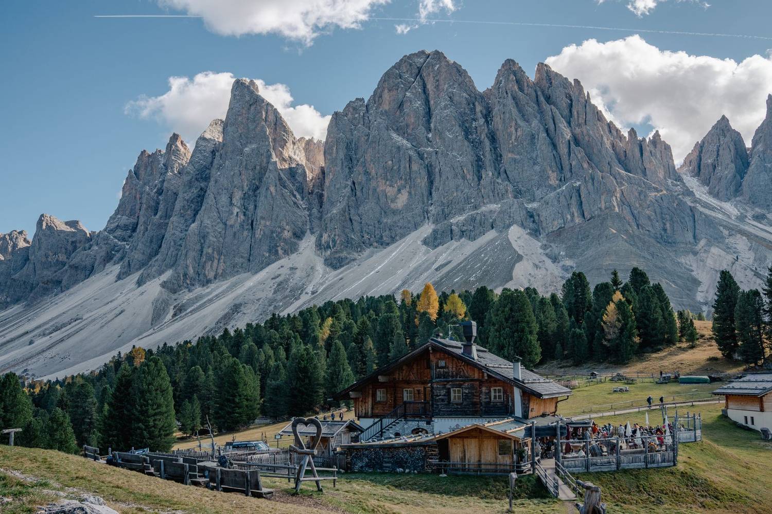 Stunning landscape of Dolomites with an alpine lodge, capturing the essence of nature's beauty and tranquility.